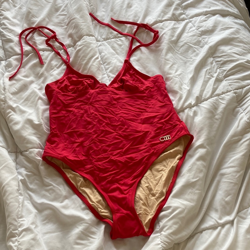 Never worn Solid and striped red/pink one piece size xl The Olympia